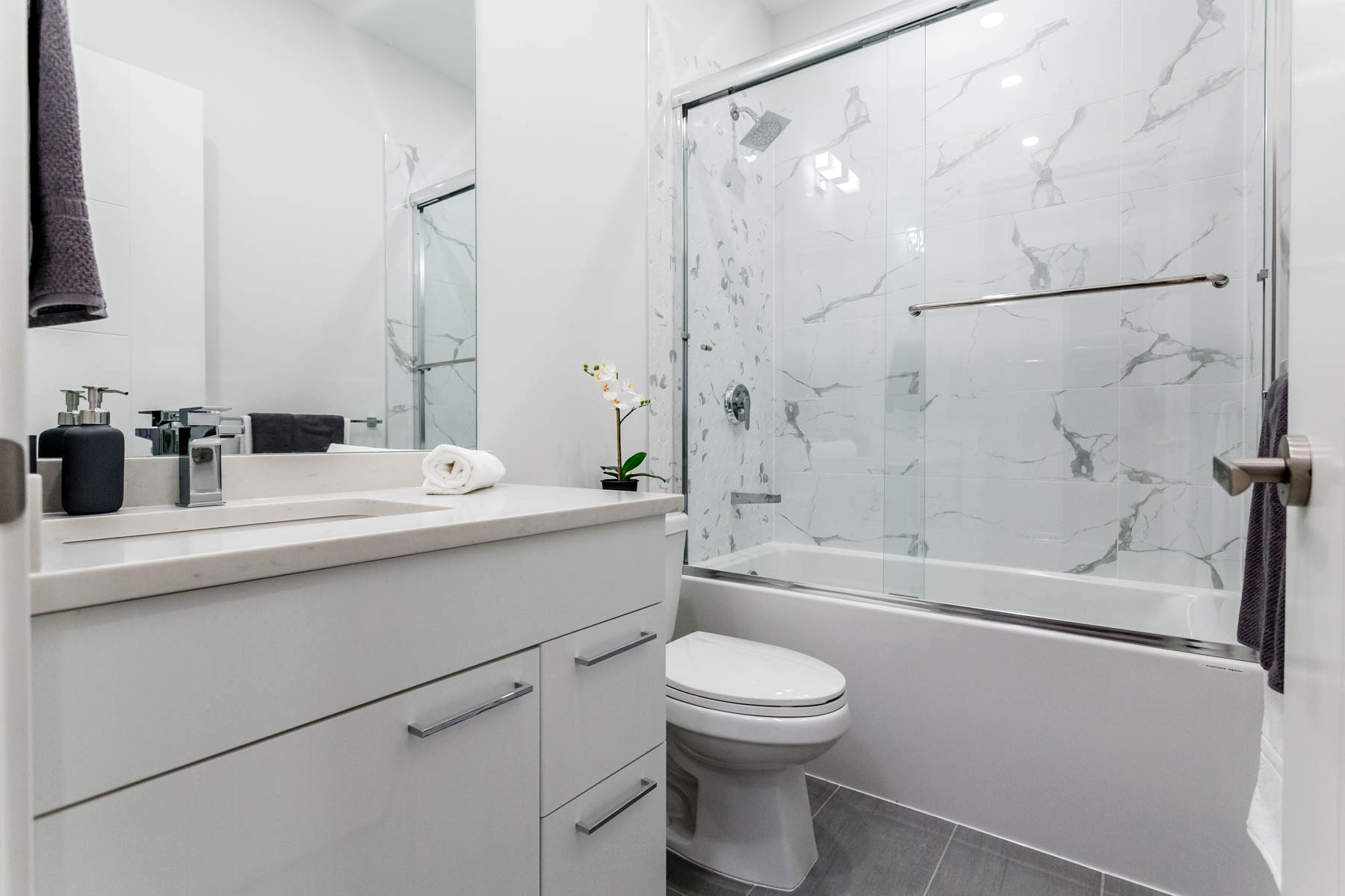 Natural stone granite countertops fill the spa-inspired bathrooms.