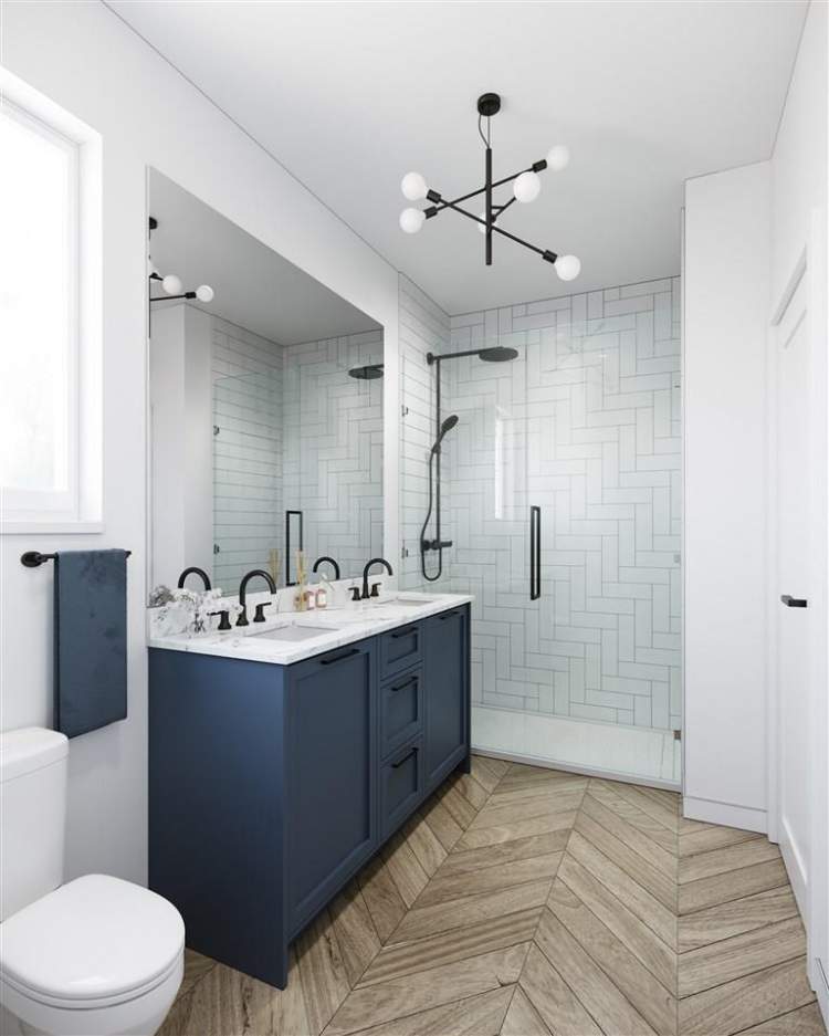 En suites showcase a mixture of large scale porcelain marble floor tiles and wide plank wood tiles.
