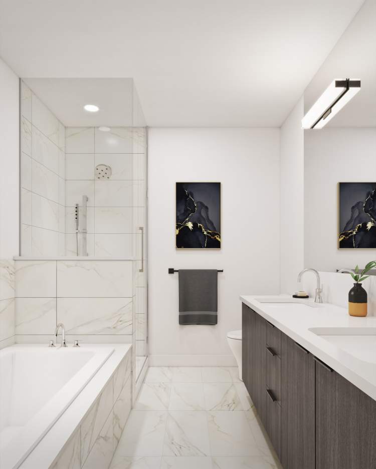En suites include oversized vanity with dual sinks, deluxe soaker tub, and a frameless glass shower.