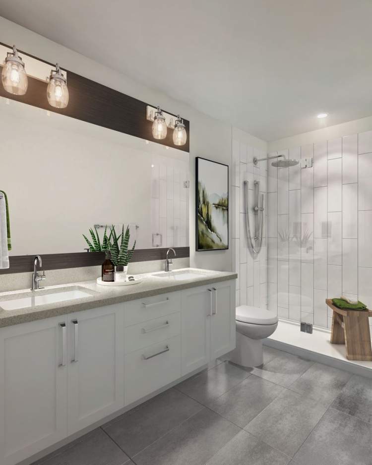 En suites feature frameless glass showers, spacious quartz countertops, and dual undermount sinks.