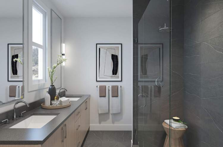 En suites feature glass-enclosed, ceramic tile shower.