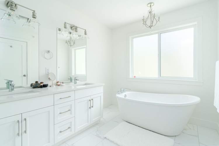 En suite includes double vanities and free-standing soaker tub.