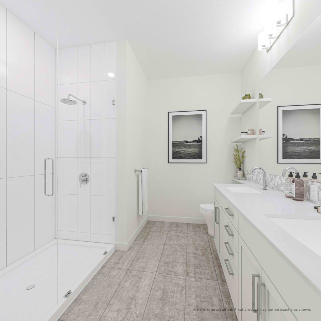 Easy-clean laminate countertops, melamine cabinets, and semi-frameless glass shower stalls.