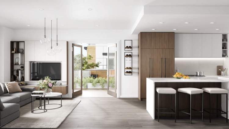 Natural or dark walnut flows from the floor-to-ceiling cabinetry and across the front of the large kitchen island.