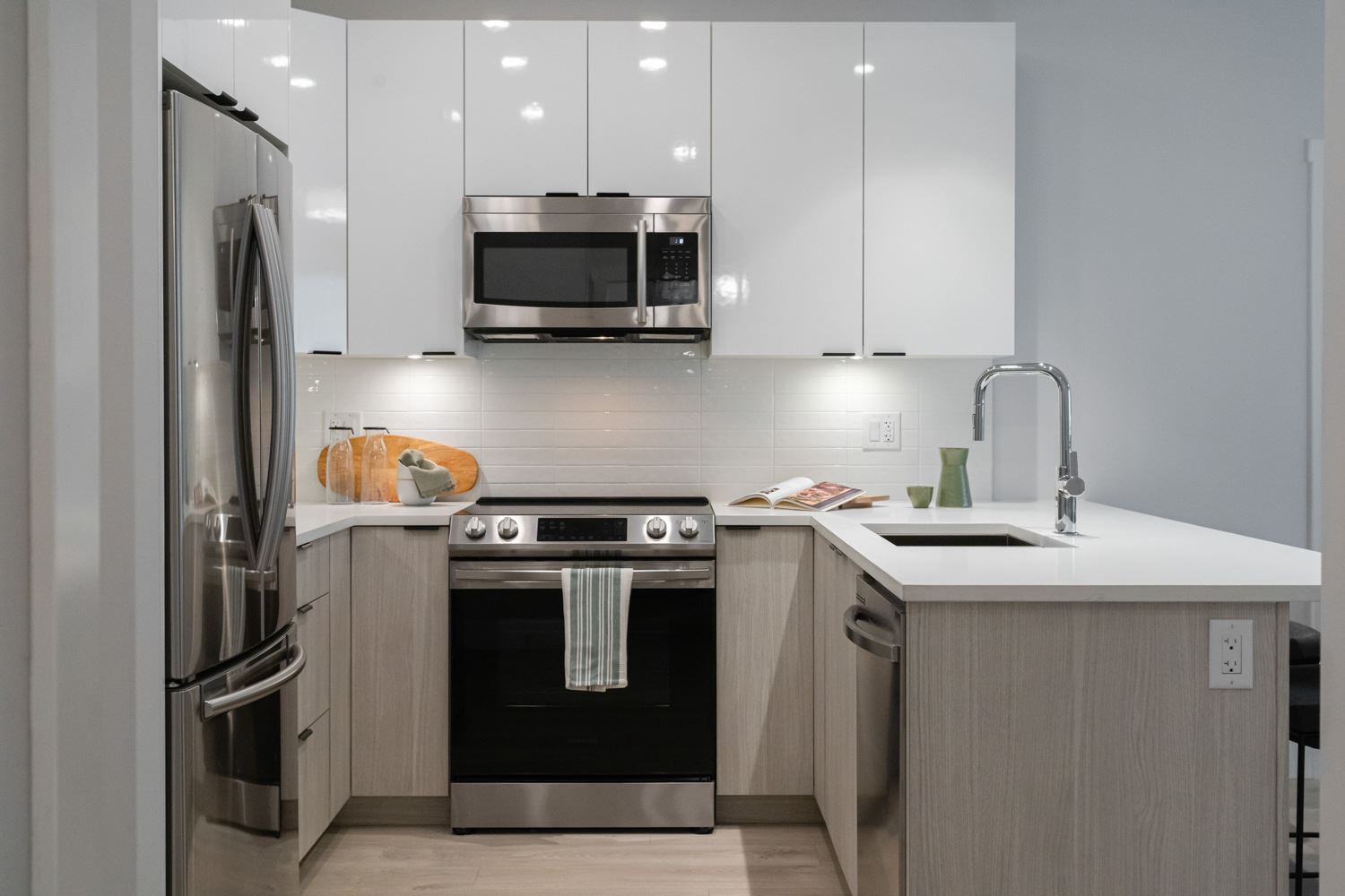Equipped with ultra-quiet appliances and quartz stone countertops.