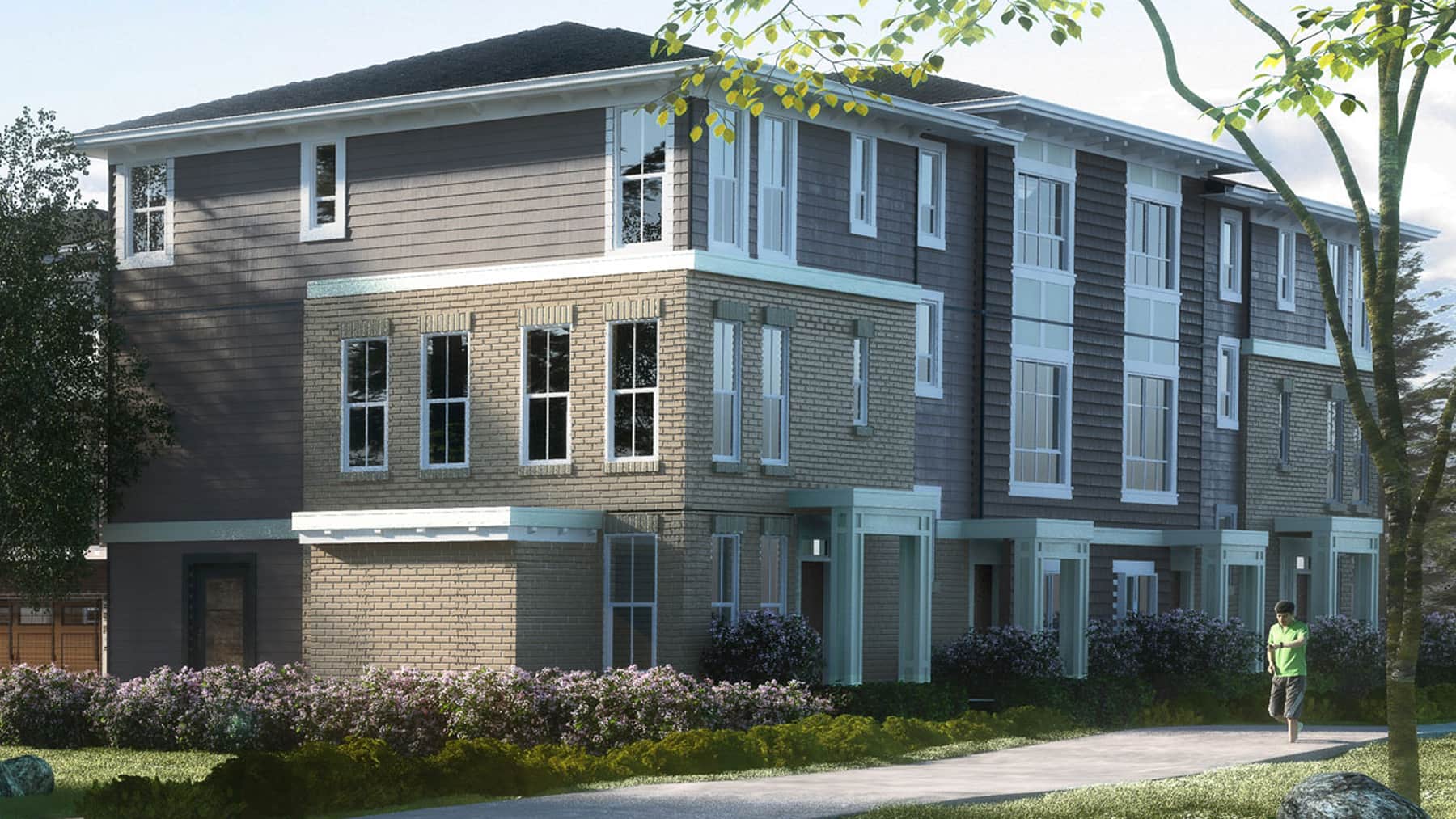 Georgian-style, 3-storey townhomes with shake and shiplap siding and light colour brick highlights.