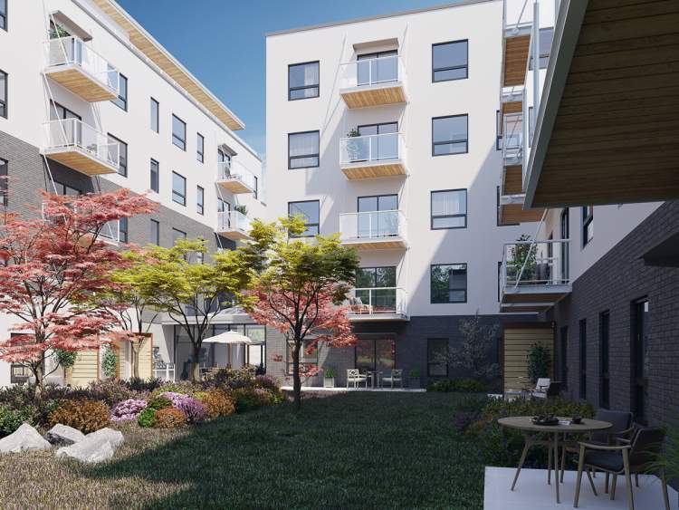 An interior courtyard provides a green area and amenity space for residents.