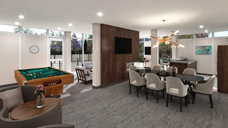 A multi-function room with a lounge, fireplace, kitchen, dining area, and billiards table.