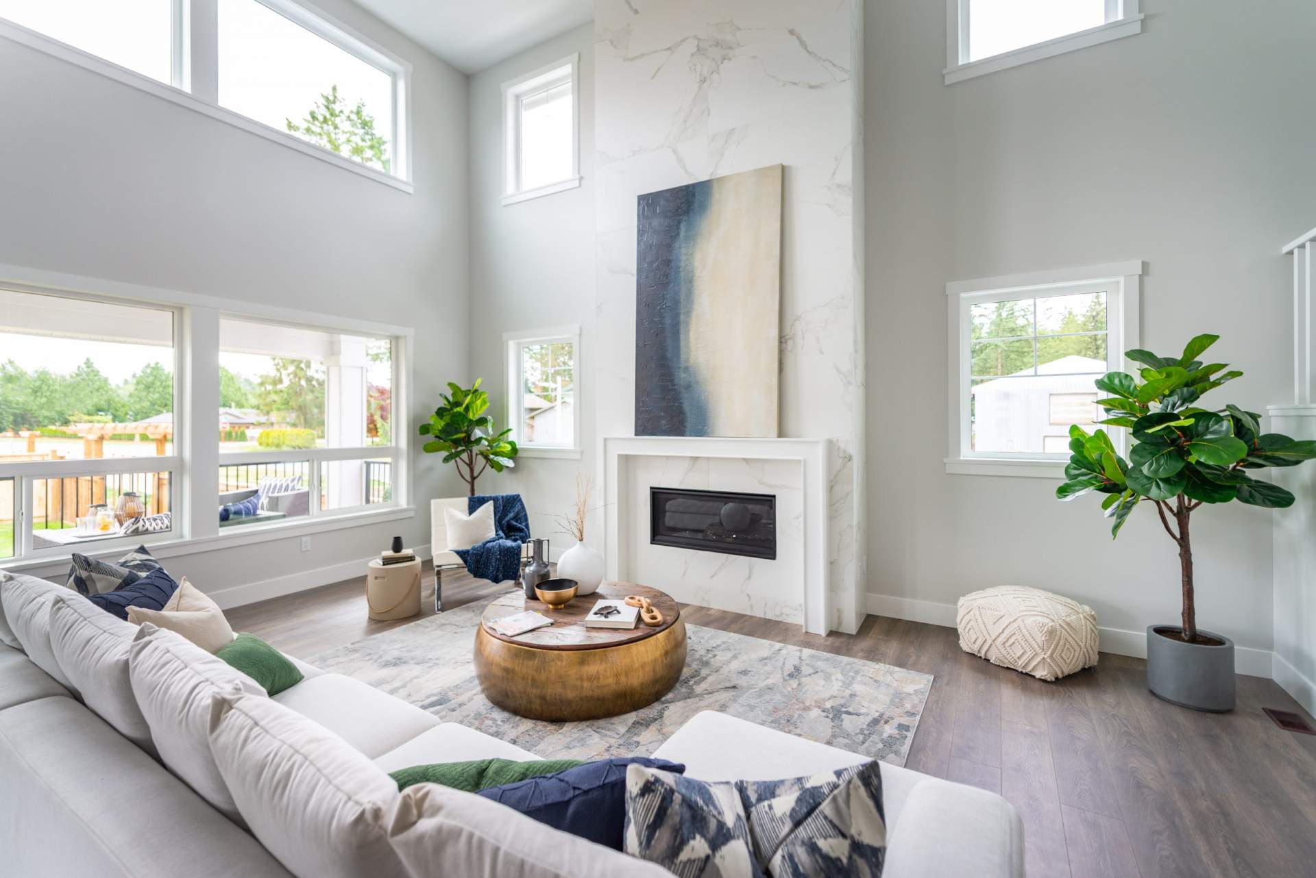 Oversized windows and a gas fireplace encased in designer tile offer the perfect ambience.
