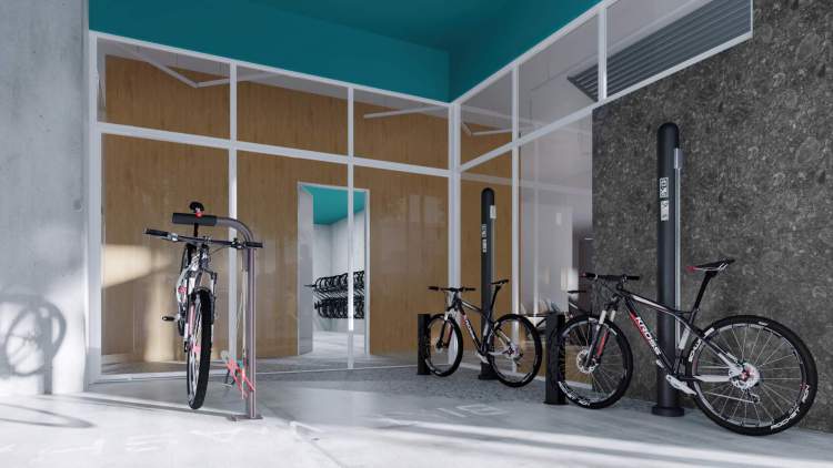 A ground level bike lounge with spaces to clean, store, and repair your bike.
