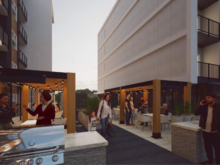 Between the two buildings on the roof of the lobby is an outdoor amenity with seating areas.