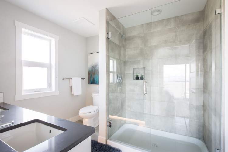 Features a full-height, tiled en suite shower with 10mm frameless door.