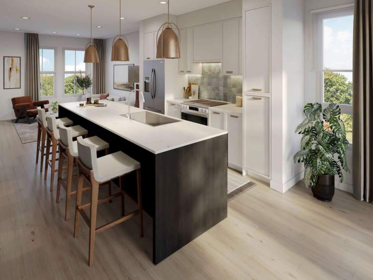 Gourmet kitchens feature generous islands, quartz countertops, and Samsung stainless steel appliances. 