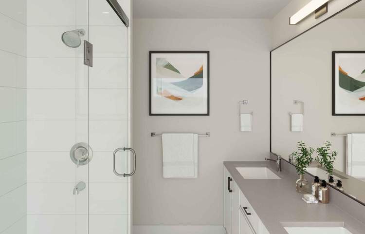 Bathrooms have soft-close white contemporary cabinetry and grey quartz countertops.