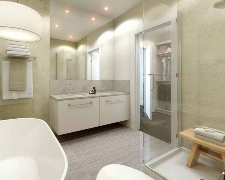 European-designed fixtures, free-standing tubs, floor-to-ceiling tiled walls, and seamless glass showers.