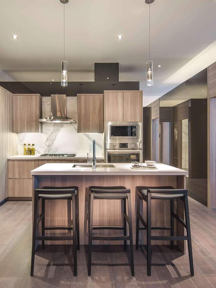 Refined design, up-to-date European appliances, custom wood grain laminate cabinetry.