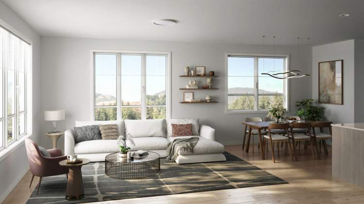The spacious main living area features 9′ ceilings and large windows.