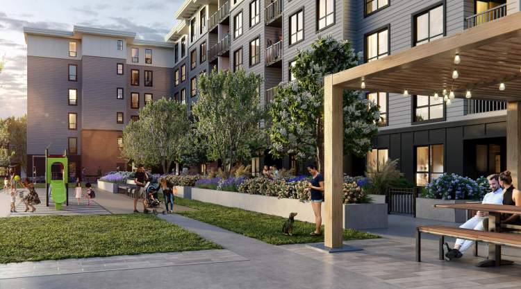 The Flats at The Rail District outdoor seating space and children's play area.